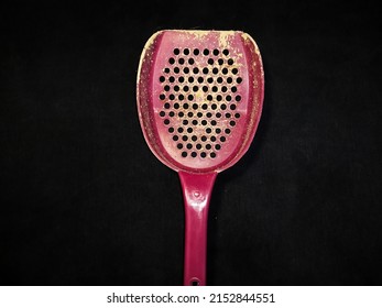 Pet Sand Shovel Isolated On A Black Background