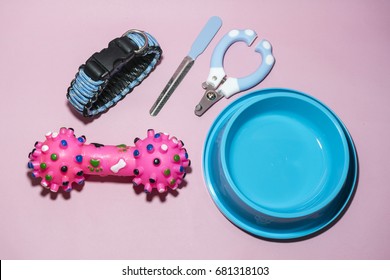 Pet supplies have collars, nail scissors. Bowls of food or water and toys