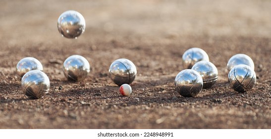 Petanque ball boules bowls on a dust floor, photo in impact. Game of petanque on the ground. Balls and a small wood jack - Shutterstock ID 2248948991
