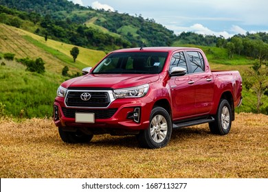 petchaburi,Thailand:20-November-2018:Red Toyota Hilux Revo parking at the green mountain