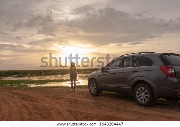 Petchburi ,Thailand - January 20 2019:\
Private car test drive, Gray color Chevrolet Captiva Photo on\
country road at Pranburi\
beach,Thailand