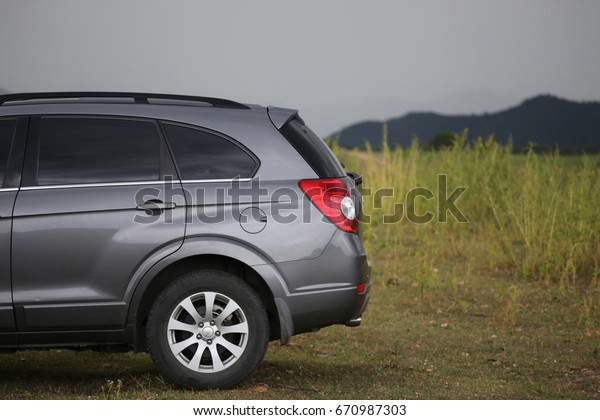 Petchburi,Thailand -June 30 2017:\
Private car test drive, Gray color Chevrolet Captiva Photo on\
country road  at\
Petchburi,Thailand