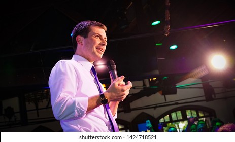Pete  Buttigieg talking to a crowd with a mic in hand smiling at The Abbey Los Angeles California 2019 presidential candidate Democrat lgbt Gay Mayor