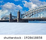 Peter Great Bridge in Saint Petersburg. Russia in a winter day. Bolsheokhtinsky bridge over Neva. Winter Neva in Saint Petersburg. Winter landscape of Russian city. Car tour in Russia.