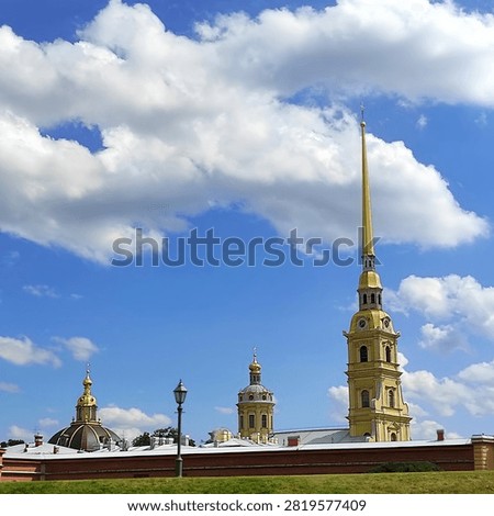 The Peter and Paul Cathedral, located within the Peter and Paul Fortress, features a bell tower with a spire. It is a historical symbol of the city and the tallest building in its historic part. The cathedral was built in the Petrine Baroque style according to the designs of the architect Domenico Trezzini.