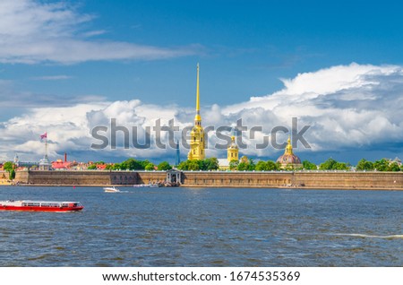 The Peter and Paul Fortress citadel, Saints Peter and Paul Cathedral Orthodox church with gold spire, fortress walls on Zayachy Hare Island, Neva river, Saint Petersburg Leningrad city, Russia