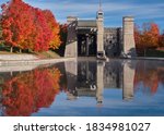 The Peterborough Lift Lock and surrounding colorful autumn trees are reflected in the Trent Canal.