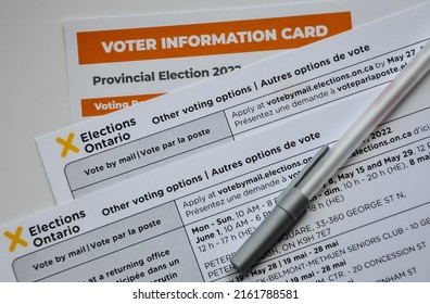 Peterborough, Ontario, Canada - May 29, 2022: Voter Information Cards For Provincial Election In Ontario With Pen On Top.