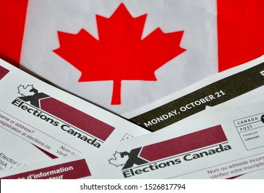 Peterborough, Ontario, Canada - October 8, 2019: Election Canada Voter Information Cards For Federal Election Over Small Canadian Flag.