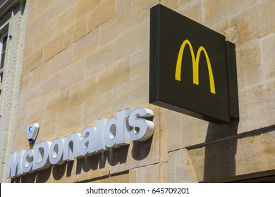 PETERBOROUGH, UK - MAY 22ND 2017: The recognisable McDonalds logo above one of their restaurants in Peterborough, UK, on 22nd May 2017.