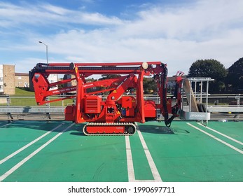 Peterlee, Great Britain - October 1, 2020 : Promax Cherry Picker Industrial Lifter Crane With Catapiller Tracks In Red.  Parked.