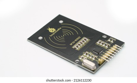 PETERSBURG, RUSSIA - JANUARY, 26, 2022: RFID key copy clone electronic component. Electronic proximity key for intercom at white isolated. Arduino module, breadboard, microcontroller.