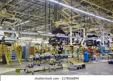 Petersburg, Russia - November 2017: Car Production line, Body frame hanging, lean manufacturing of automotive industrial. The car assembly the car skeleton. Automobile factory.