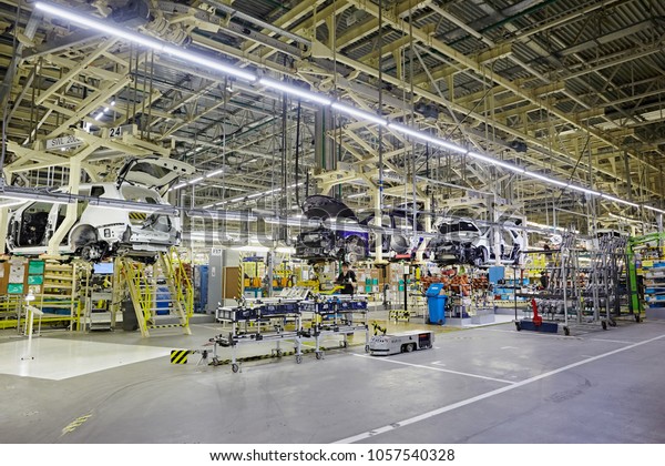Petersburg, Russia -\
November 2017: Car Production line, Body frame hanging, lean\
manufacturing of automotive industrial. The car assembly the car\
skeleton. Automobile\
factory.\

