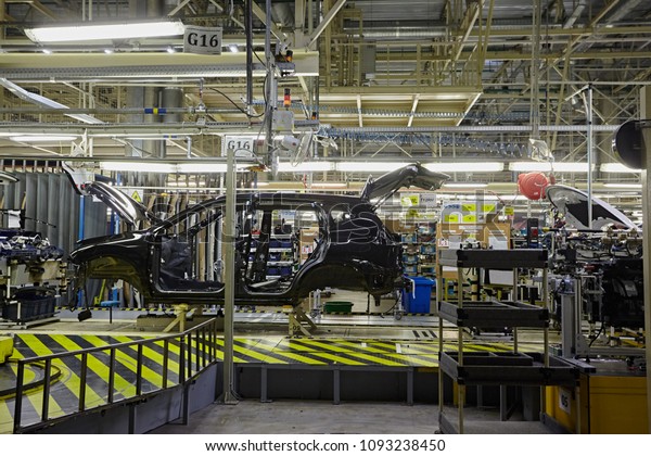 Petersburg, Russia -\
November 2017: Car Production line, Body frame hanging, lean\
manufacturing of automotive industrial. The car assembly the car\
skeleton. Automobile\
factory.\
