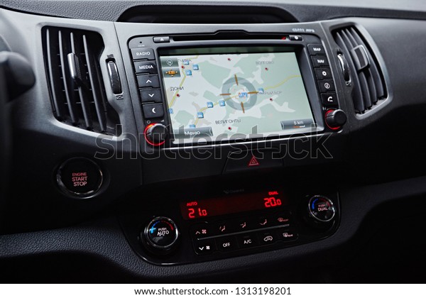 Petersburg, Russia - Oktober 2017:  Modern\
media display in the interior of the car. Touch screen with\
multimedia shows navigation and location in Kia\
Sportage
