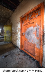 Petersburg, VA / USA - 051720 : Hallway With Colorful Doors In The Isolation Ward Of An Abandoned Hospital