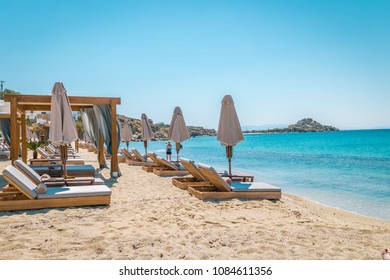 Petinos Beach Mikonos Island Greece, Luxury Beach Bed Chairs And Blue Ocean