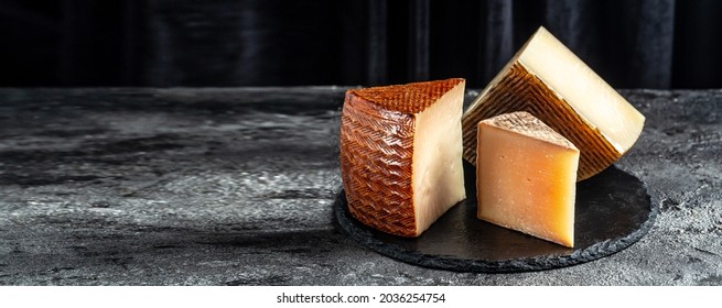 Petit Basque, French cheese, Cheese board of various types of soft and hard cheese. spanish manchego cheese. - Powered by Shutterstock