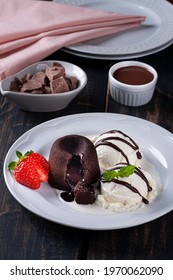 Petit Gateau With Ice Cream And Strawberry On White Plate