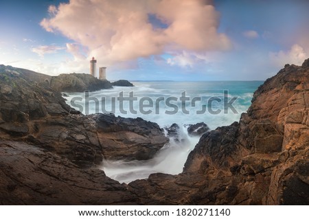 Similar – Leuchtturm an felsiger Küste am Meer