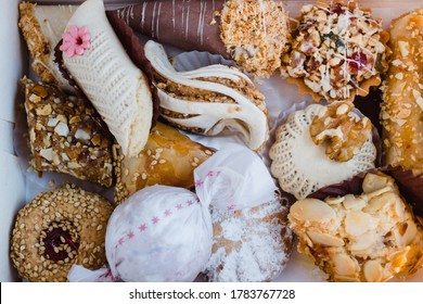 Petits Fours Marocains (translated As Moroccan Sweets) Seen From A Top View. It Includes Briouates And Almond Cookies. 