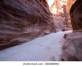 Petra, January 2020,  Jordan: An Empty Horse Cart Runs Along The Siq In Petra Towards The Treasury In Search Of Tourists.