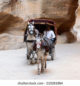 PETRA, JORDAN - APR 29, 2014: Unidentified People In A Horse Carriage In Petra, Jordan. Petra Is One Of The New Seven Wonders Of The World.