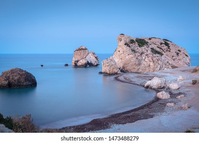 Petra Tou Romiou seashore and stones formation at sunrise, Cyprus, long exposure