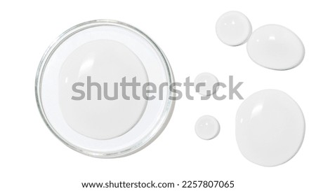 Petri dish. large drops of transparent gel or serum or water, on a white background, top view, isolated