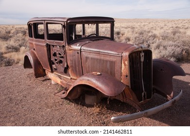 PETRIFIED FOREST, ARIZONA - DECEMBER 18, 2013: Old, rusted 1931 Studebaker sedan automobile, on the old U.S. Route 66, at Petrified Forest National Park.