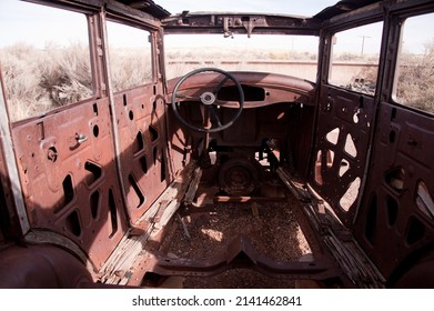 PETRIFIED FOREST, ARIZONA - DECEMBER 18, 2013: Rusted interior of 1931 Studebaker sedan automobile, with steering wheel. on the old U.S. Route 66, at Petrified Forest National Park.