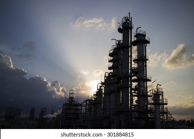 Petrochemical column and light beam in background. - Shutterstock ID 301884815