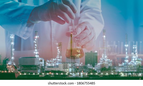 Petrochemical concept composite image of laboratory testing tube on the Oil&Gas refinery background showing the concept of high quality control of product