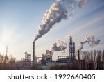 Petrochemical industrial factory of heavy industry, power refinery production with smoke pollution. Thick smoke is coming from the factory