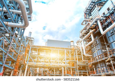 Petrochemical oil refinery, Refinery oil and gas industry, The equipment of oil refining, Close-up of Pipelines and petrochemical industrial plant towers view of oil and gas refinery
