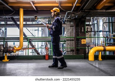 Petrochemical worker controlling process of crude oil production inside oil and gas refinery plant. - Shutterstock ID 2221455235