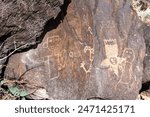 Petroglyph National Monument in Albuquerque, New Mexico along West Mesa, a volcanic basalt escarpment. Petroglyph images carved by Ancestral Pueblo people and early Spanish settlers. Boca Negra Canyon
