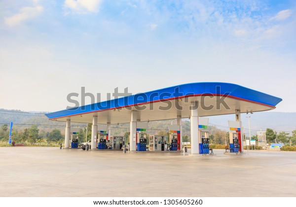 Petrol gas fuel\
station with clouds and blue\
sky