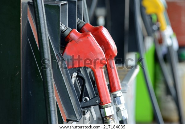 Petrol gas\
station pump and pumping gasoline\
fuel