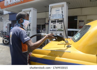 Petrol Pump Employee Refill Fuel At Taxi During Unlock 2 Due To COVID 19 Coronavirus Pandemic On July 2,2020 In Calcutta, India.