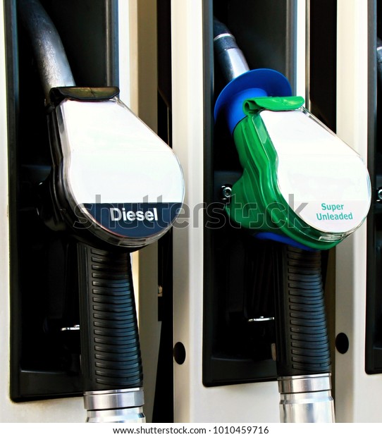 petrol pump with unleaded fuel at a\
petrol station no people stock image and stock\
photo