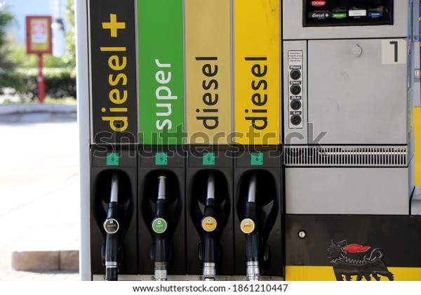 Petrol pumps of an Agip petrol\
station. Diesel, super, unleaded petrol. Puglia, Italy\
25-11-2020
