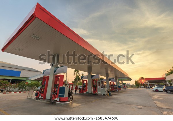 Petrol station and Gas\
station at sunset.