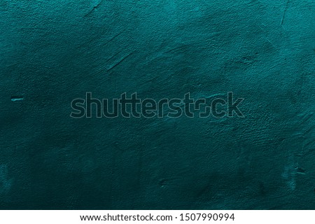 Petrol or teal colored background with textures of different shades of petrol or teal.
