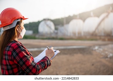 Petroleum Engineers. Happy Asian Worker Woman In Oil Chemical Industry Worker Working Visual Inspection List On Clipboard In Plant, Do Action Of Worker Do Safety Checklist Which Is Clipped