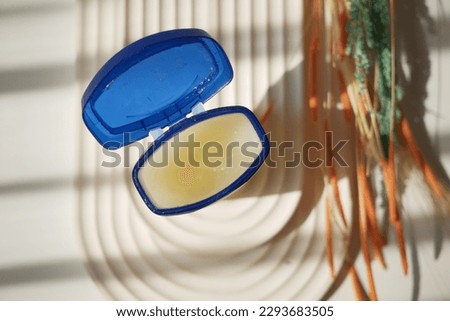 petroleum jelly in a open container with sun light 
