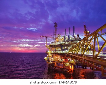 Petroleum oil and gas process offshore field, Drilling, discovery and development of oil and gas resources which lie underwater through drilling a well,construction out at sea wtih HDR sunset.
