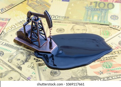 Petroleum, petrodollar and crude oil concept : Pump jack and black oil spill on US USD dollar notes, depicts the money received or earned from sales after investment in the development of oil industry
