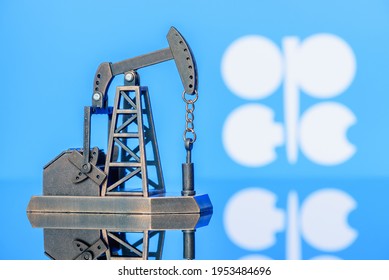 Petroleum, petrodollar and crude oil concept : Pump jack and flag of OPEC or Organization of Oil Exporting Countries, depicts the investment in the development or production of global oil industry.